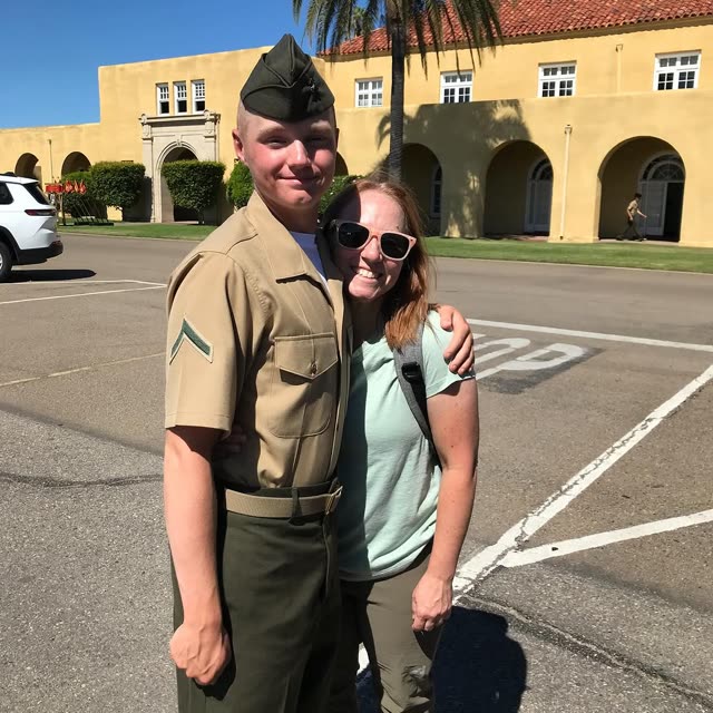Stacey with her son in his Marine Corps uniform